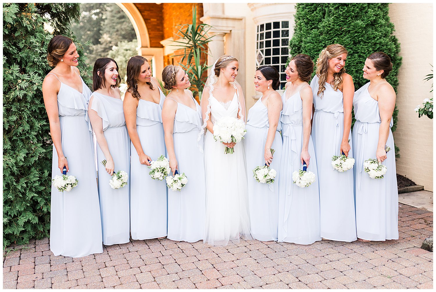 Light blue bridesmaids with bride