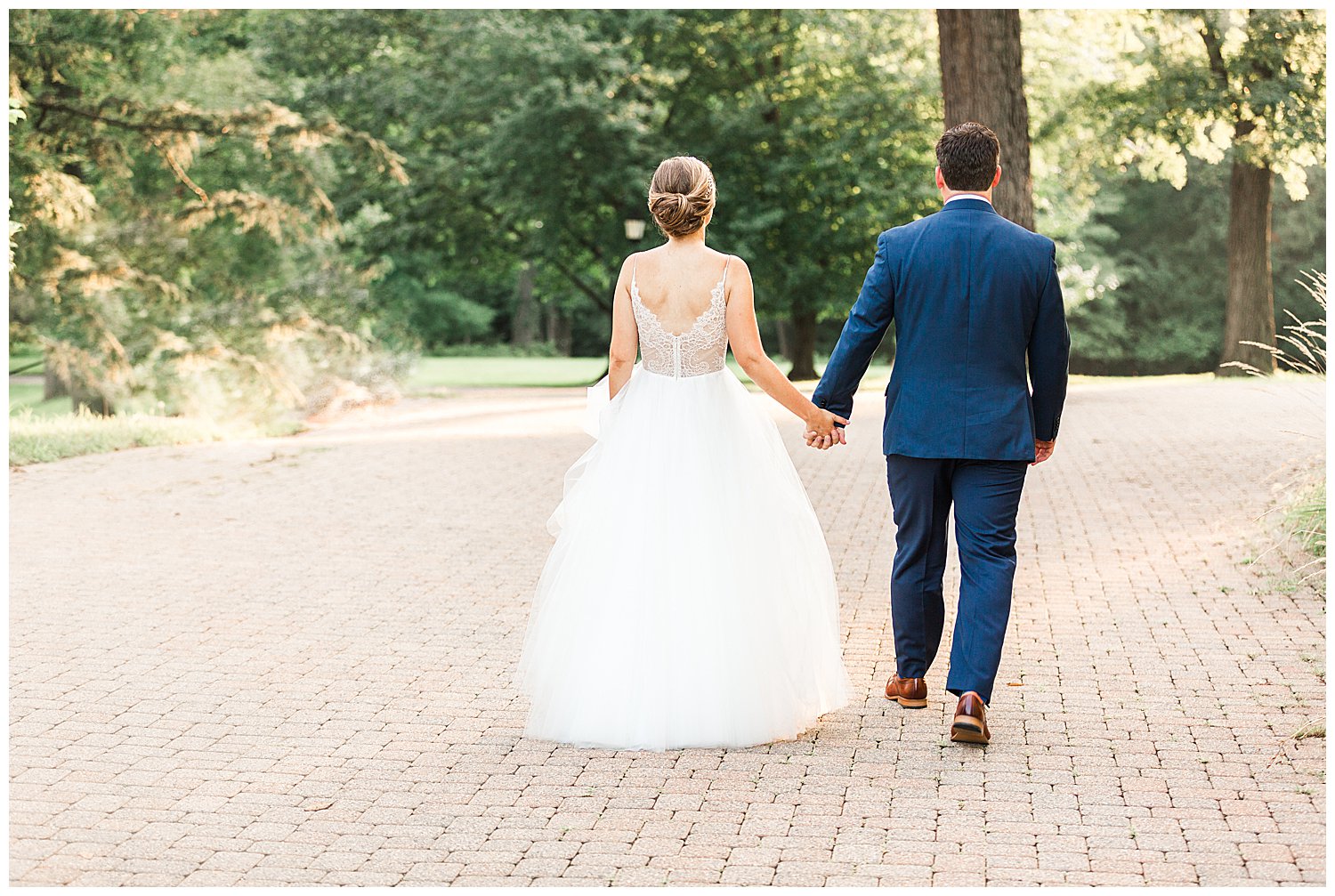 bride and groom portrait walking away