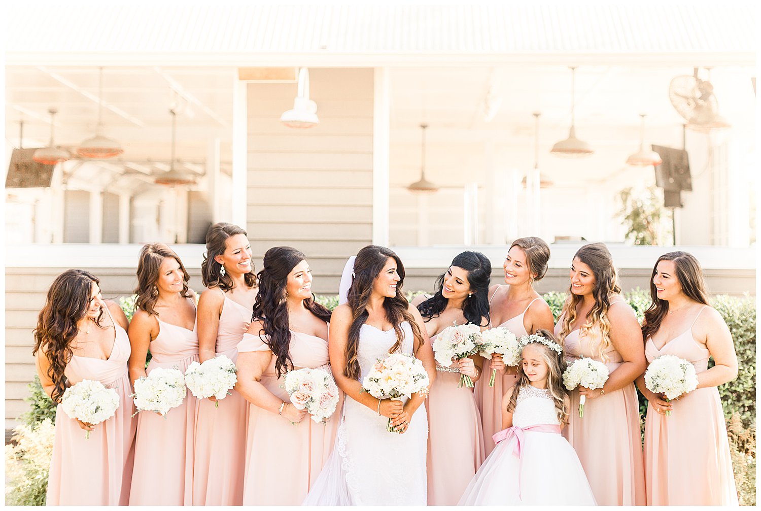 Bridesmaids and bride in blush and white