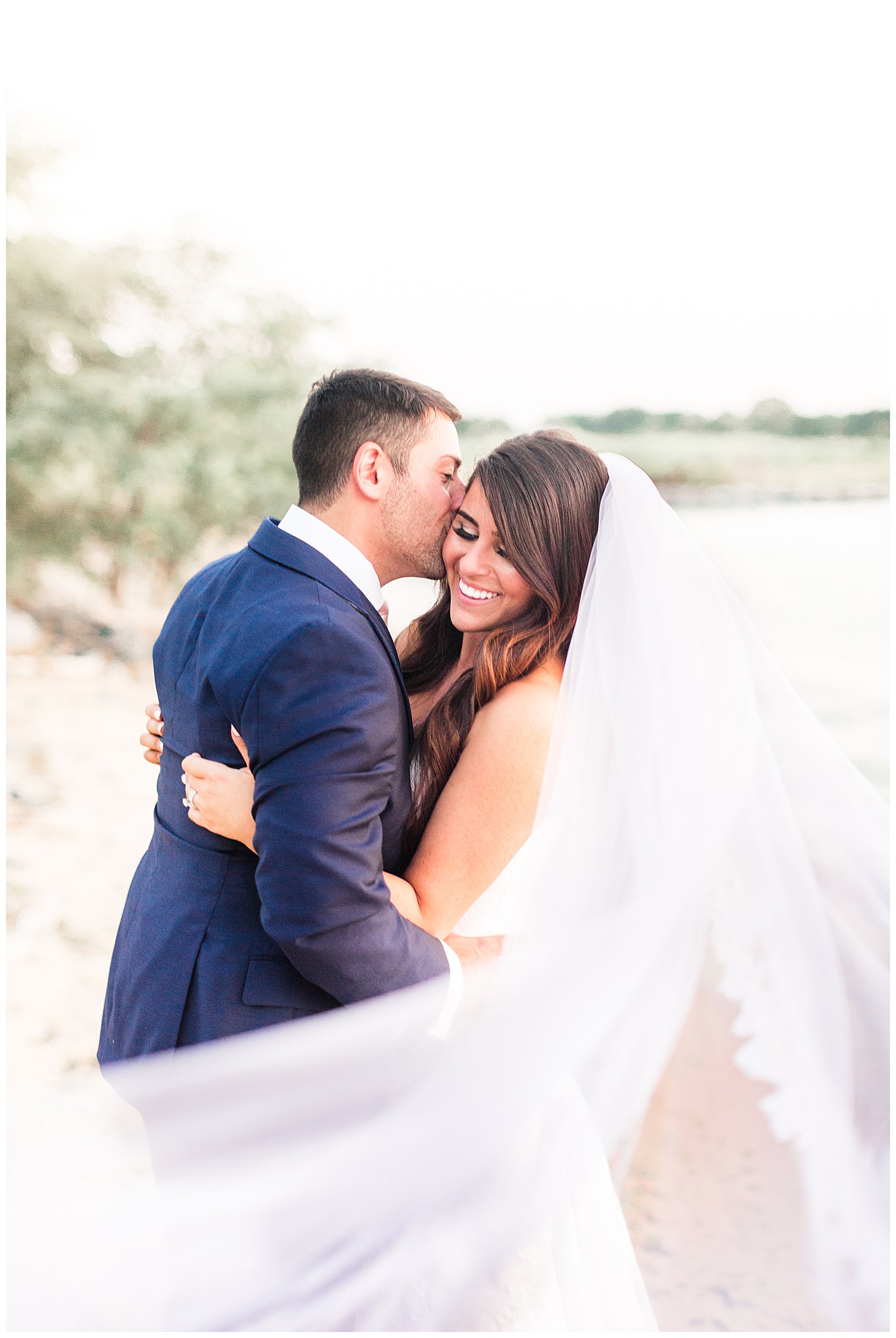 Bride and groom portrait with veil